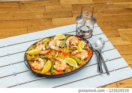 Paella is a typical Spanish rice dish. Paella is a typical Spanish rice dish. 123629539