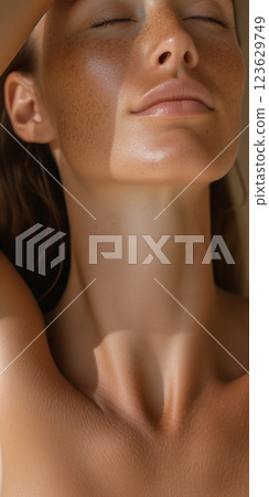 A woman with a tan complexion and a smile on her face A woman with a tan complexion and a smile on her face 123629749