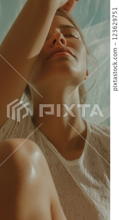 A woman with a white dress and a tanish skin A woman with a white dress and a tanish skin 123629751