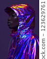 A woman is wearing a purple jacket with a hood. Cyberpunk concept 123629761