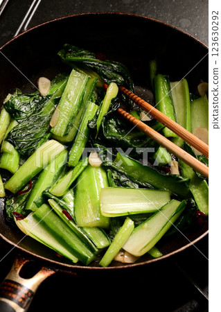 Stir-fried greens being cooked 123630292