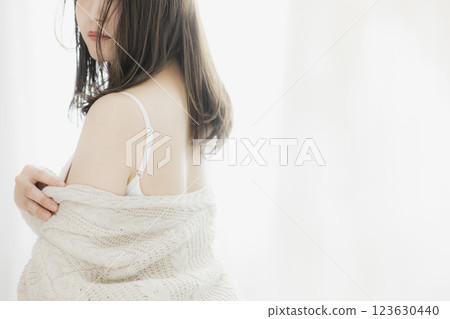 Woman in white knit Woman in white knit 123630440
