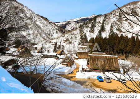 Village of old houses buried in snow 123630529