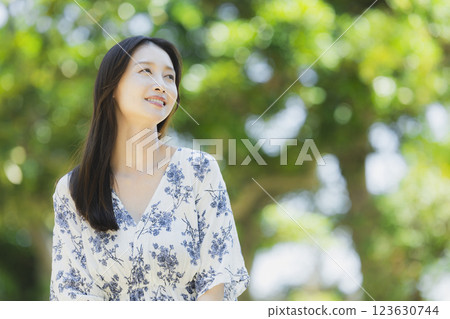 A woman in fresh green A woman in fresh green 123630744