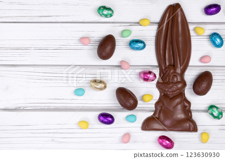 Easter chocolate bunny with assorted eggs on white table. Easter chocolate bunny with assorted eggs on white table. 123630930