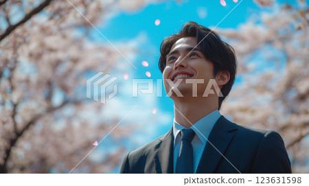 Smiling man under the cherry blossoms Smiling man under the cherry blossoms 123631598
