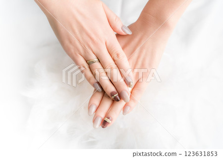 Nail salon - woman doing gel nails (beige, brown, autumn/winter design) Nail salon - woman doing gel nails (beige, brown, autumn/winter design) 123631853