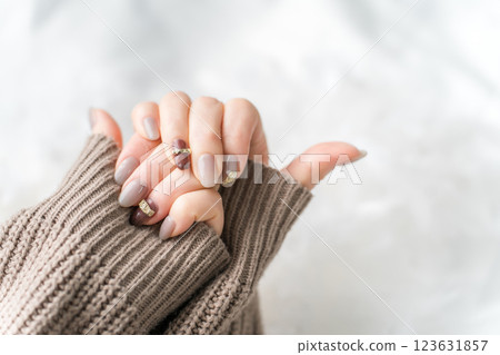 Nail salon - woman doing gel nails (beige, brown, autumn/winter design) Nail salon - woman doing gel nails (beige, brown, autumn/winter design) 123631857
