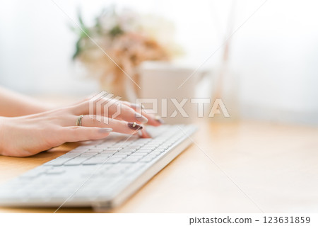 Woman with nails using a computer (work, gel nails, fashion designer) 123631859