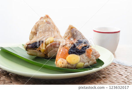 Traditional chinese Zongzi are sweet sticky rice dumplings that are eaten during the Dragon Boat festival. 123632017