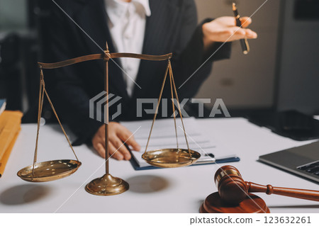 Judge gavel with Justice lawyers having team meeting at law firm background. Concepts of Law and Legal services. 123632261