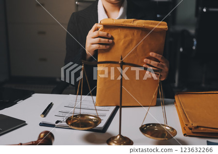 Judge gavel with Justice lawyers having team meeting at law firm background. Concepts of Law and Legal services. 123632266