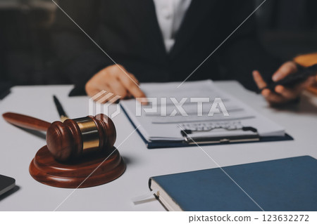 Judge gavel with Justice lawyers having team meeting at law firm background. Concepts of Law and Legal services. Judge gavel with Justice lawyers having team meeting at law firm background. Concepts of Law and Legal services. 123632272
