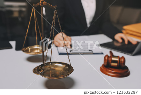 Judge gavel with Justice lawyers having team meeting at law firm background. Concepts of Law and Legal services. Judge gavel with Justice lawyers having team meeting at law firm background. Concepts of Law and Legal services. 123632287