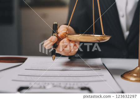 Judge gavel with Justice lawyers having team meeting at law firm background. Concepts of Law and Legal services. Judge gavel with Justice lawyers having team meeting at law firm background. Concepts of Law and Legal services. 123632297