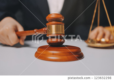 Judge gavel with Justice lawyers having team meeting at law firm background. Concepts of Law and Legal services. Judge gavel with Justice lawyers having team meeting at law firm background. Concepts of Law and Legal services. 123632298