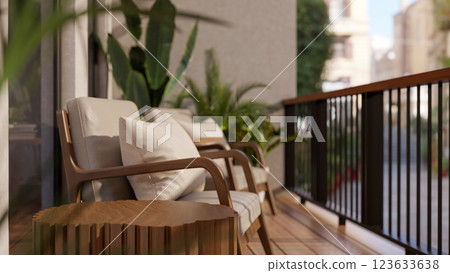 The armchairs and table place on the wooden floor balcony, with city view and sunlight shine upon. 123633638