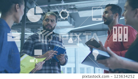 Image of digital business icons and data processing over diverse business people in office Image of digital business icons and data processing over diverse business people in office 123634252