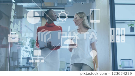 Image of digital business icons and data processing over diverse business people in office Image of digital business icons and data processing over diverse business people in office 123634259
