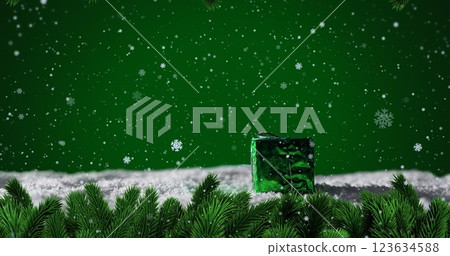 Image of snow falling over christmas present Image of snow falling over christmas present 123634588