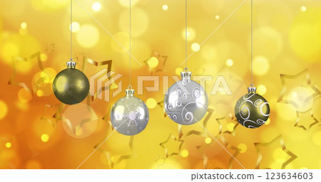Image of stars falling over christmas baubles 123634603