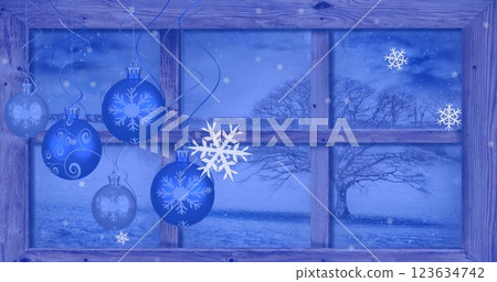 Image of christmas baubles over snow falling Image of christmas baubles over snow falling 123634742