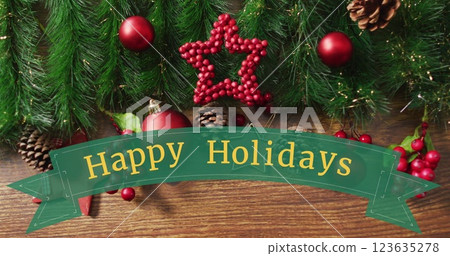 Image of christmas greetings text over christmas decorations 123635278