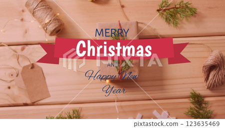 Image of merry christmas text over christmas decorations 123635469