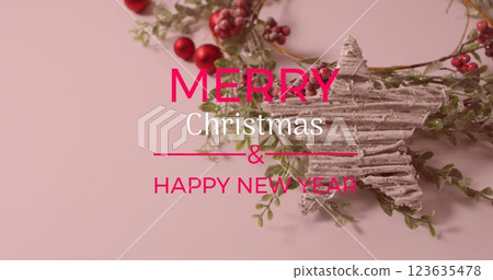 Image of merry christmas text over christmas decorations 123635478
