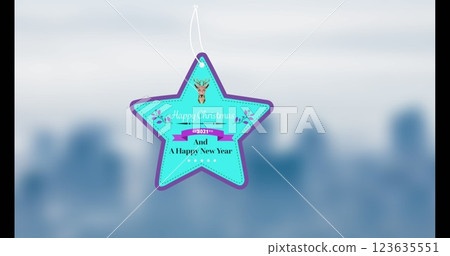 Image of gift tag with happy christmas text and icons over blurred background 123635551