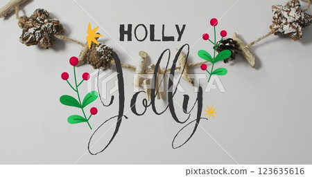 Image of happy jolly text over christmas decorations Image of happy jolly text over christmas decorations 123635616