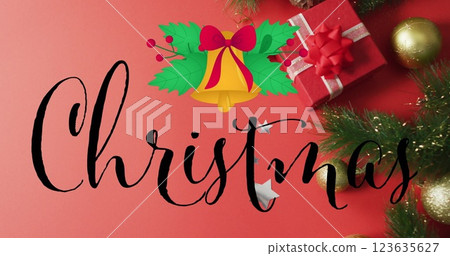 Image of christmas text over christmas decorations and present 123635627