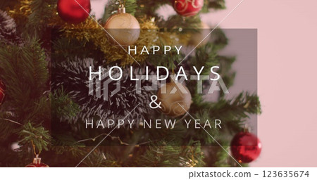 Image of happy holidays and happy new year text banner over decorative christmas tree 123635674