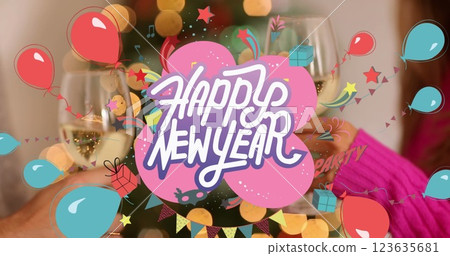 Image of happy new year text banner against mid section of couple toasting their drinks Image of happy new year text banner against mid section of couple toasting their drinks 123635681