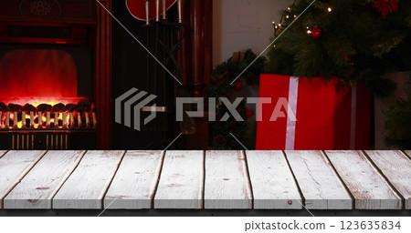 Digital composite of Wooden foreground with Christmas background of Santa with gifts Digital composite of Wooden foreground with Christmas background of Santa with gifts 123635834