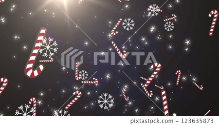 Image of snowflakes and christmas candies falling over black background with lights Image of snowflakes and christmas candies falling over black background with lights 123635873