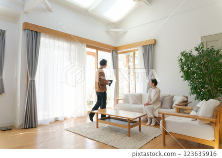 A couple relaxing in the living room 123635916