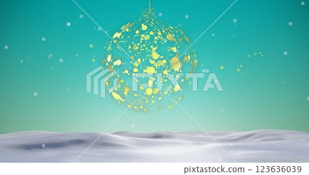 Image of gold christmas bauble swinging over snow falling over blue sky and winter landscape Image of gold christmas bauble swinging over snow falling over blue sky and winter landscape 123636039