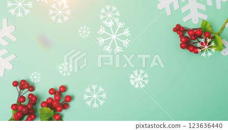 Image of falling snow and holy over blue background 123636440
