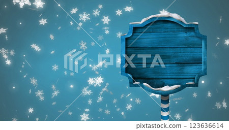 Image of christmas sign with copy space with glowing spots on blue background 123636614