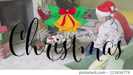 Image of christmas greetings text over caucasian senior couple on laptop image call at christmas Image of christmas greetings text over caucasian senior couple on laptop image call at christmas 123636778