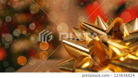 Image of light bokeh over ribbon on christmas gift Image of light bokeh over ribbon on christmas gift 123636824