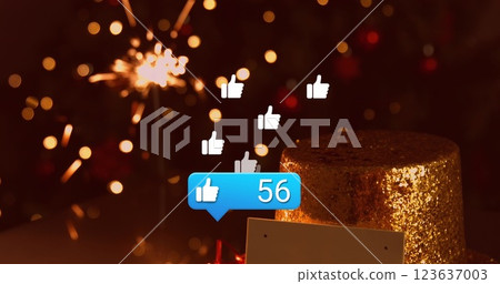 Image of social media thumb up icons over christmas tree 123637003