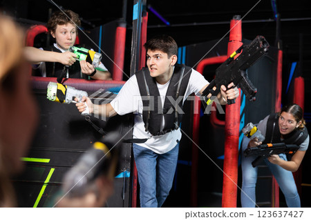 Three people playing lasertag in arena 123637427