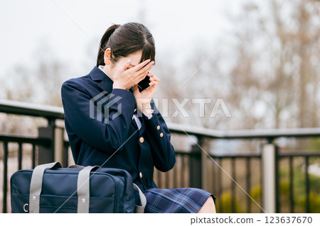 High school student/girl talking on smartphone (phone/call/contact/talk) High school student/girl talking on smartphone (phone/call/contact/talk) 123637670