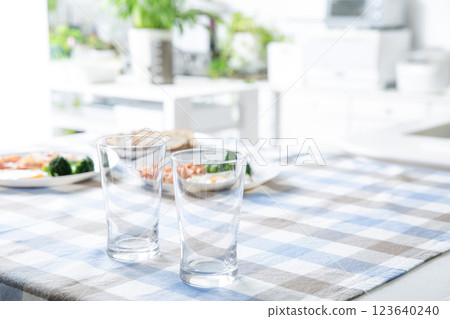 Kitchen table background tablecloth glasses Kitchen table background tablecloth glasses 123640240
