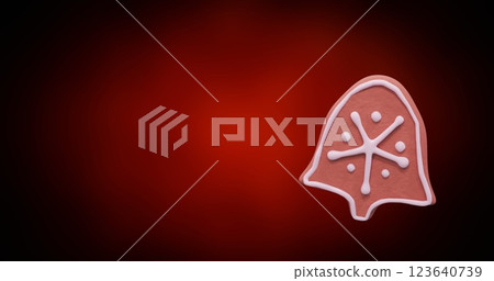 Image of christmas bell gingerbread cookie with copy space on red background 123640739
