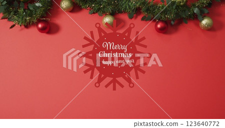 Image of merry christmas text over christmas decorations 123640772