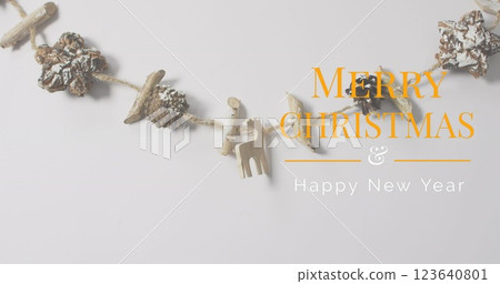 Image of christmas greetings text over christmas decorations Image of christmas greetings text over christmas decorations 123640801