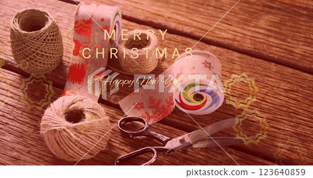 Image of merry christmas and happy new year text banner against christmas decorative items Image of merry christmas and happy new year text banner against christmas decorative items 123640859